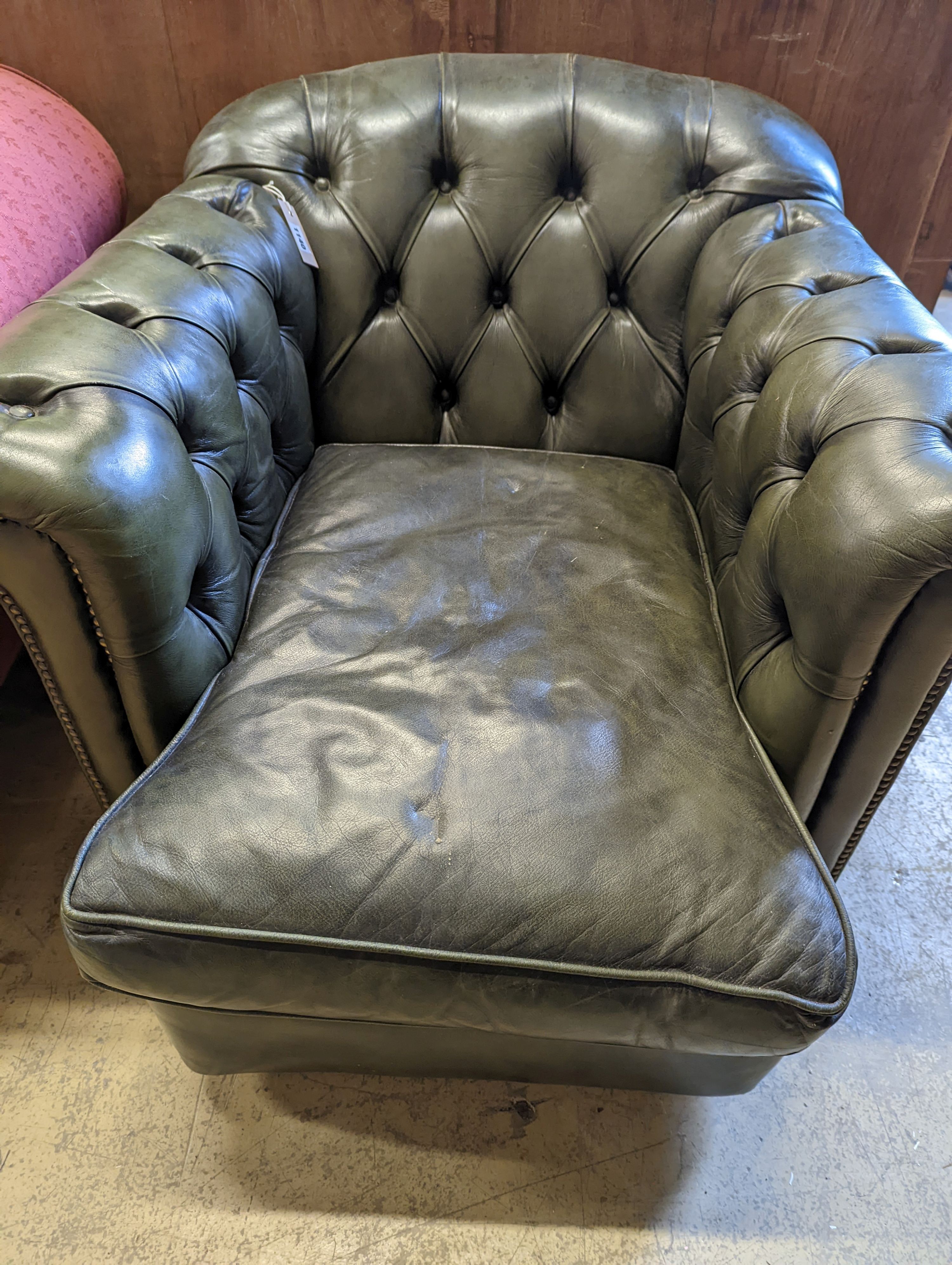 A Victorian style buttoned green leather club armchair, width 85cm, depth 100cm, height 72cm